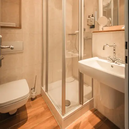 a bathroom with a shower and sink