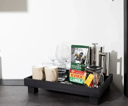 a tray with coffee cups and other items on it