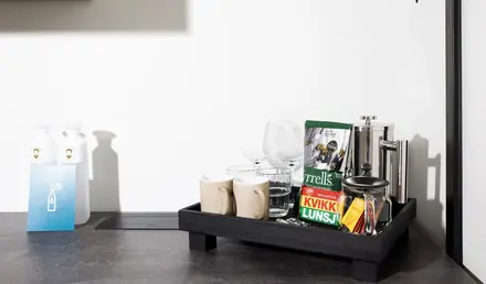 a tray with coffee cups and other items on it