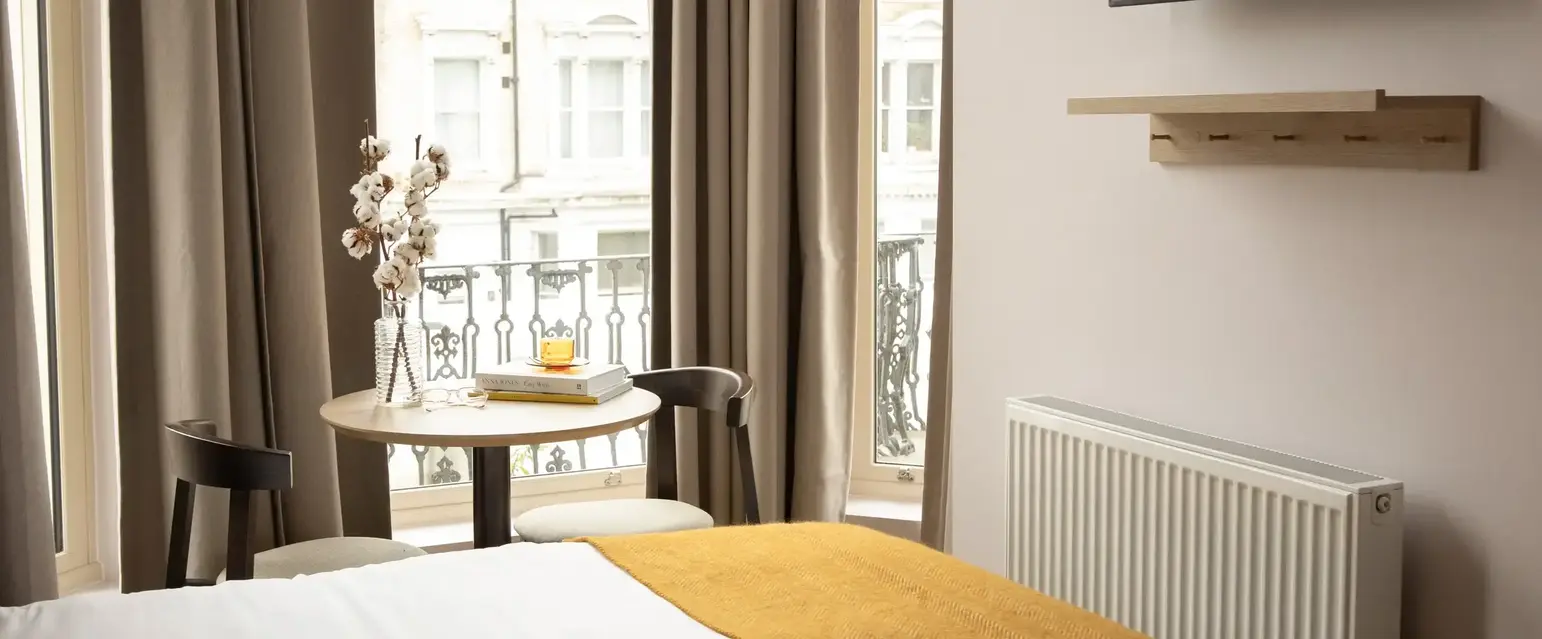 a room with a bed and a tv