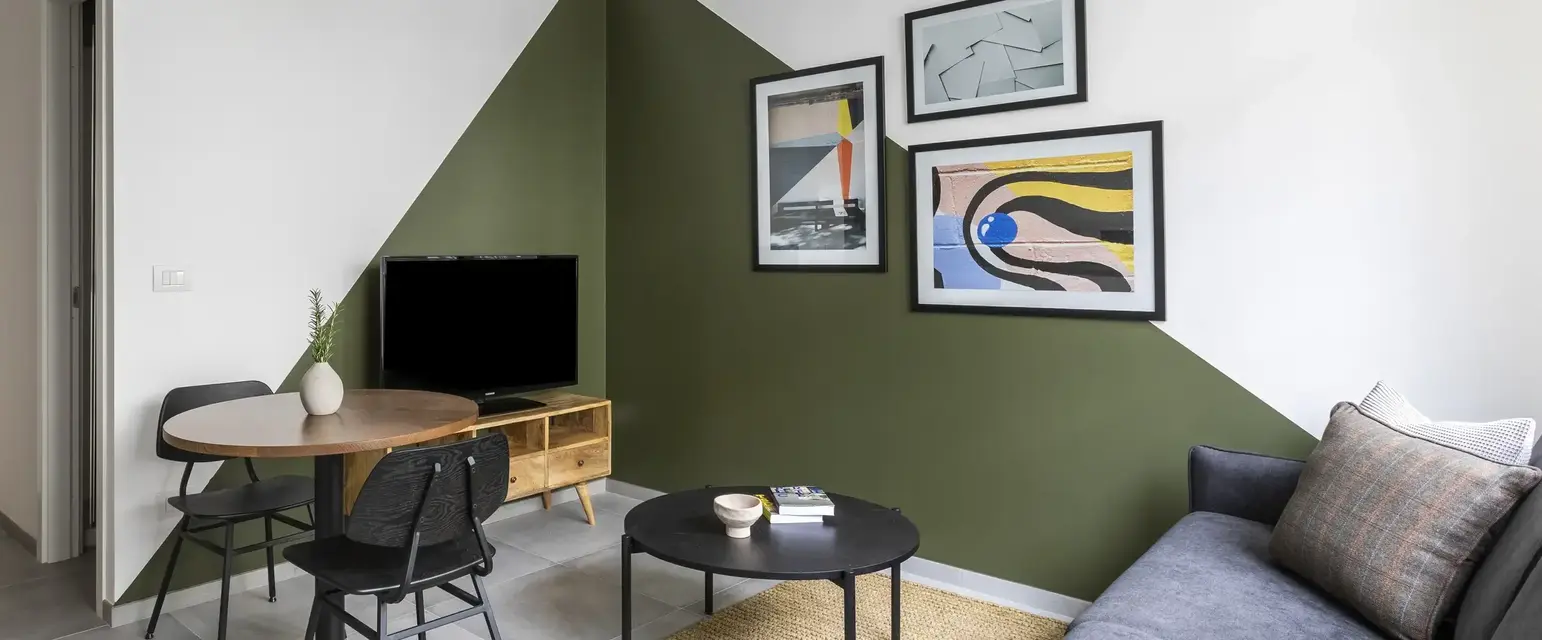 a living room with a couch and a table