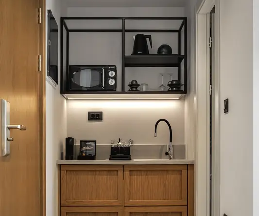 a kitchen with a microwave and a sink