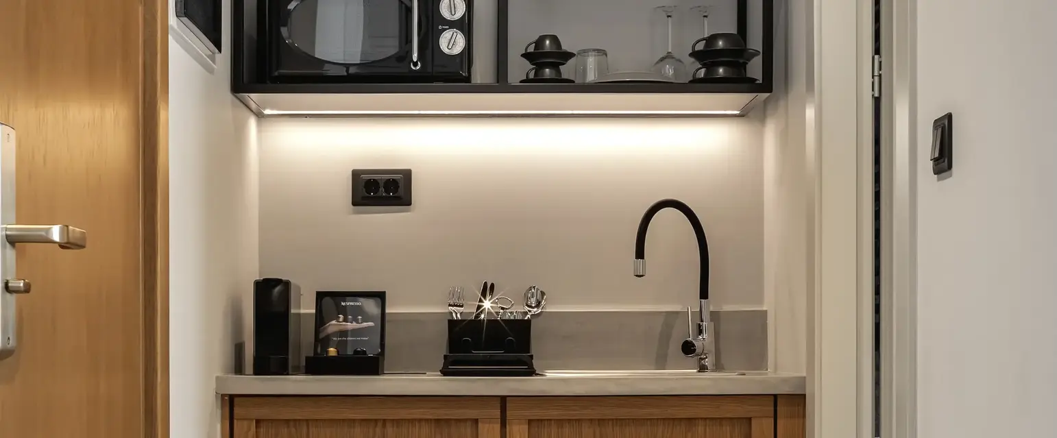 a kitchen with a microwave and a sink