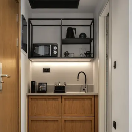 a kitchen with a microwave and a sink