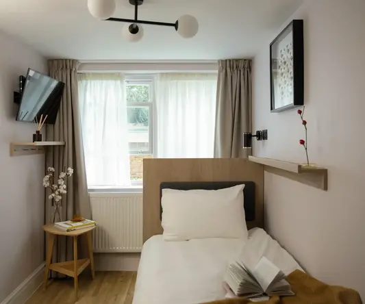 a bed with a book on it