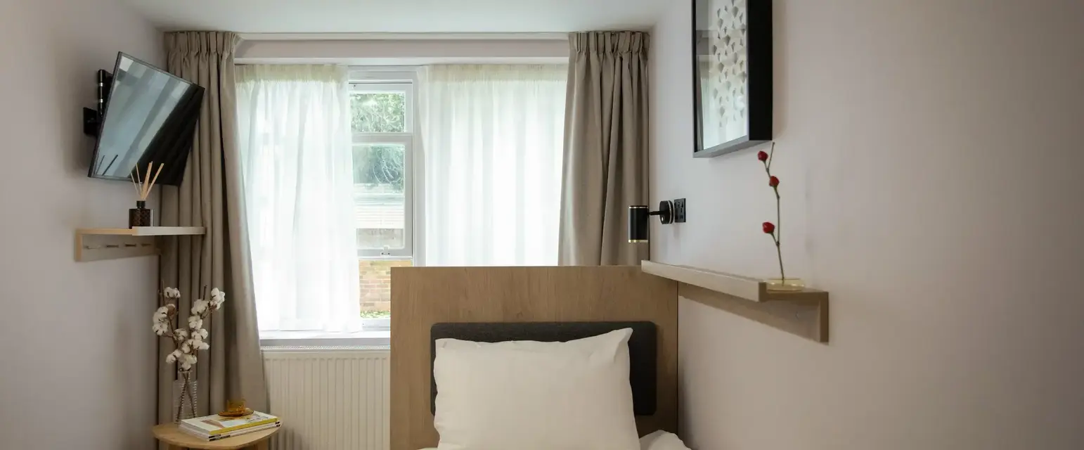 a bed with a book on it