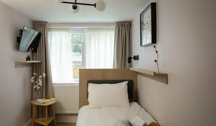 a bed with a book on it