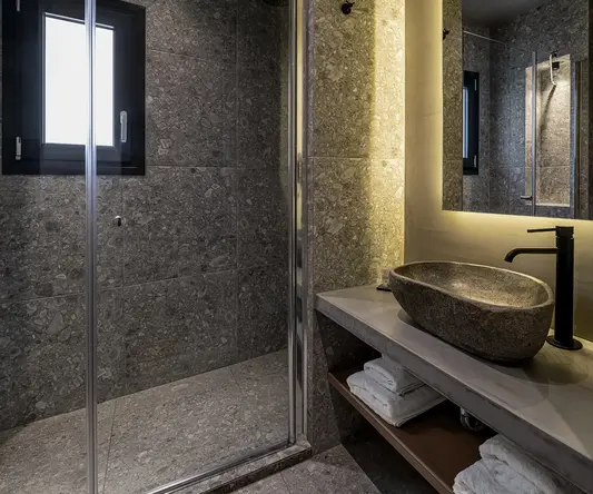 a bathroom with a shower and sink
