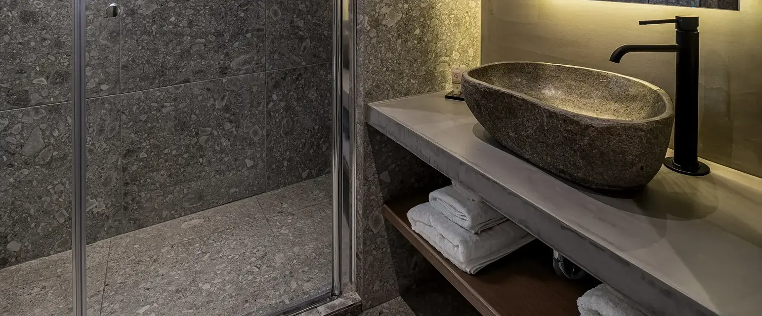 a bathroom with a shower and sink