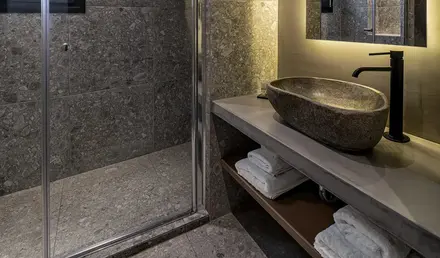 a bathroom with a shower and sink