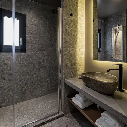 a bathroom with a shower and sink