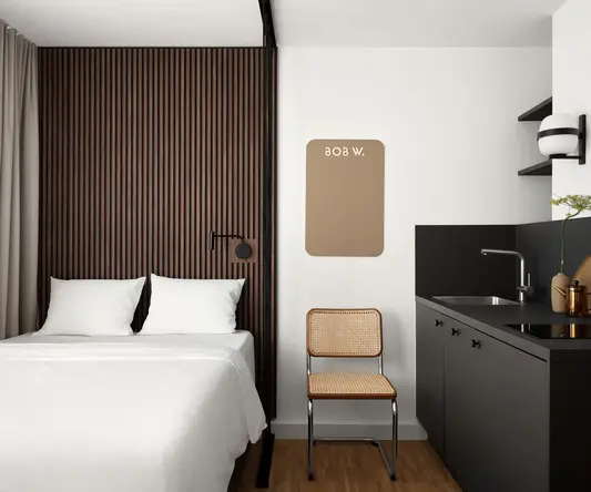a room with a bed and a chair