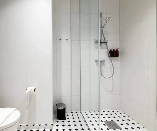 a bathroom with a glass shower