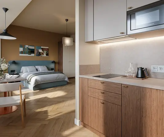 a kitchen with a bed and a microwave