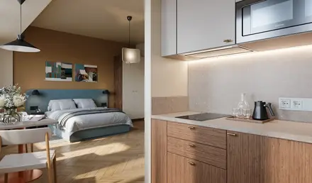 a kitchen with a bed and a microwave