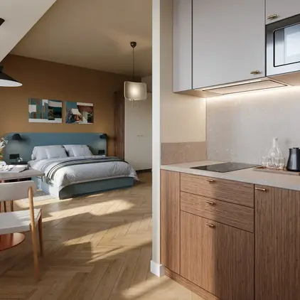 a kitchen with a bed and a microwave