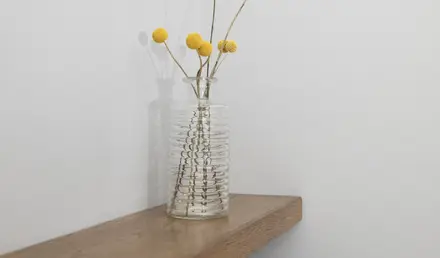 a vase with yellow flowers in it