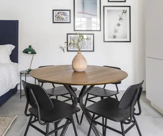 a room with a table and chairs