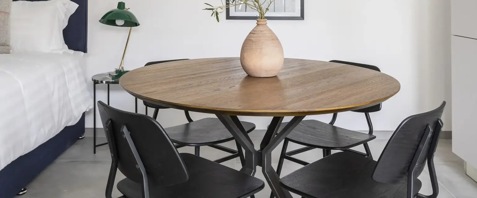 a room with a table and chairs