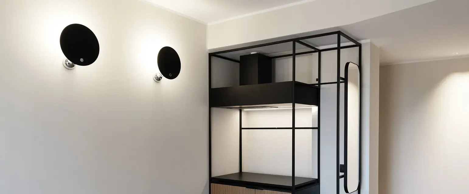 a room with a black and white shelf