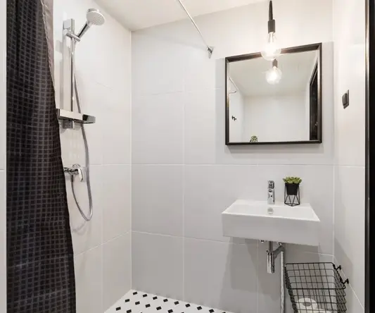 a bathroom with a sink and mirror
