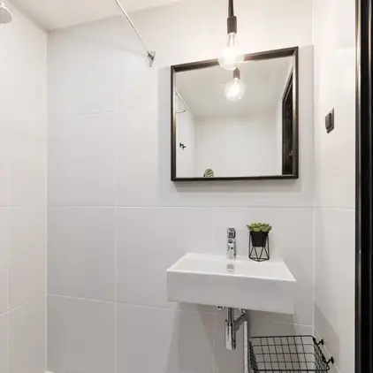 a bathroom with a sink and mirror