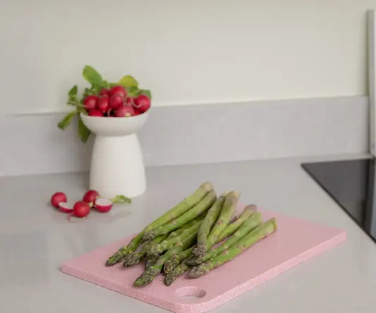 a cutting board with vegetables on it