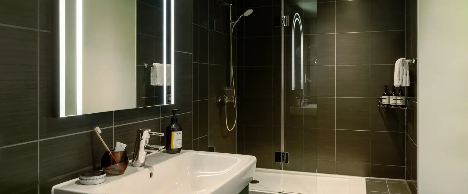 a bathroom with a mirror and sink
