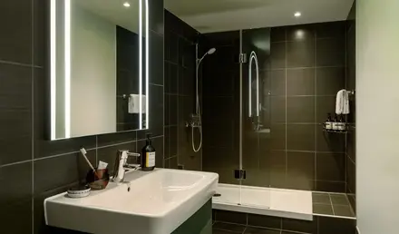 a bathroom with a mirror and sink