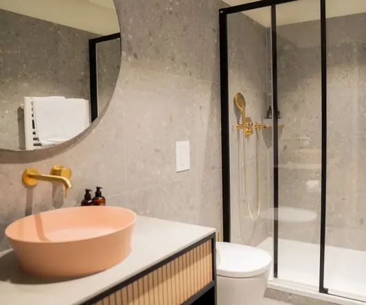 a bathroom with a shower and sink