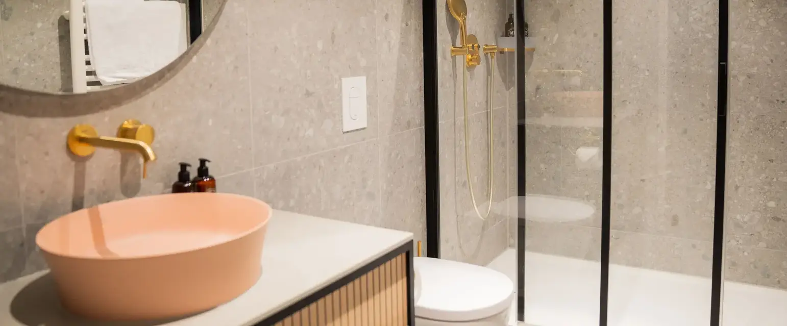 a bathroom with a shower and sink