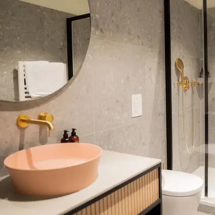 a bathroom with a shower and sink