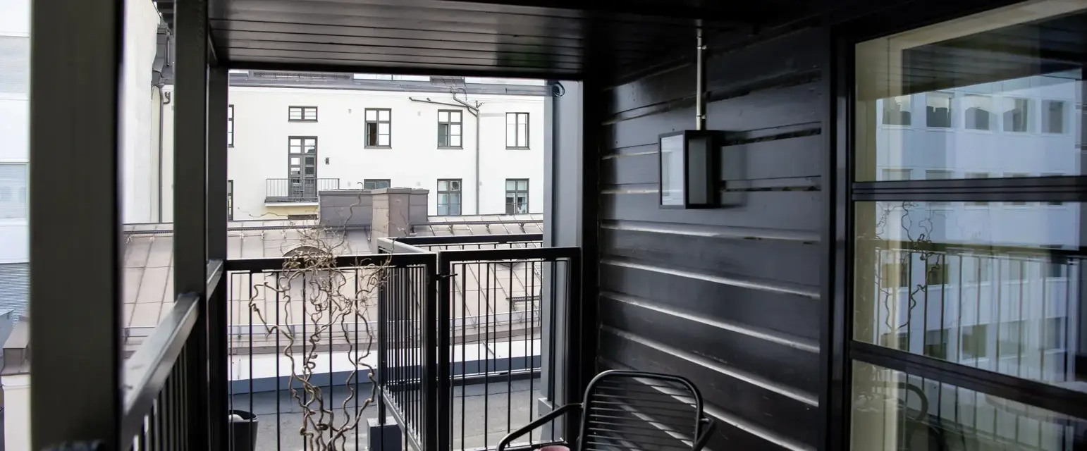 a small patio with a table and chair