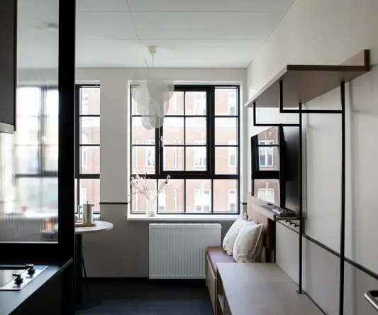 a room with a tv and a table