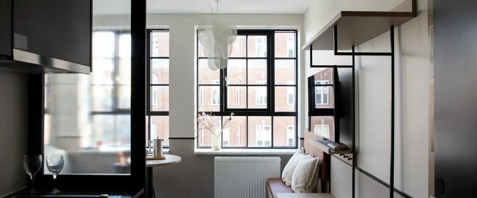 a room with a tv and a table