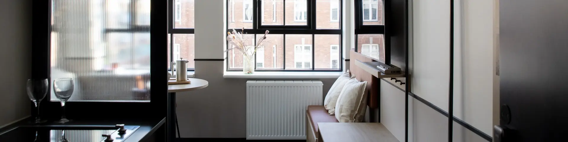 a room with a tv and a table