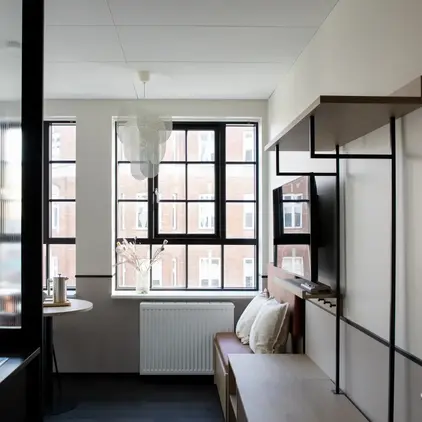 a room with a tv and a table