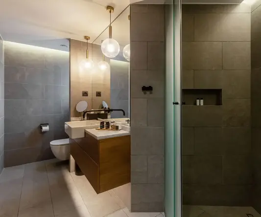 a bathroom with a shower and sink