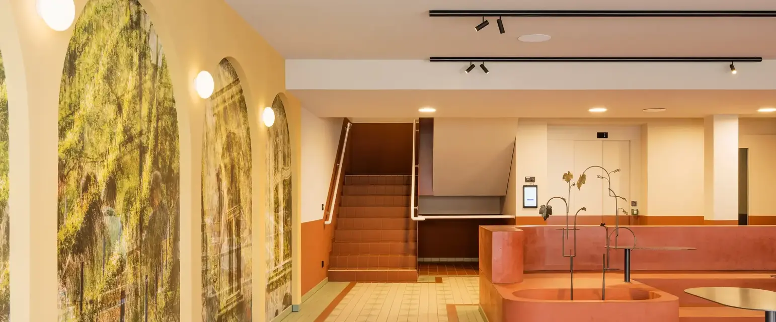 a large room with a bathtub and stairs