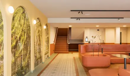 a large room with a bathtub and stairs