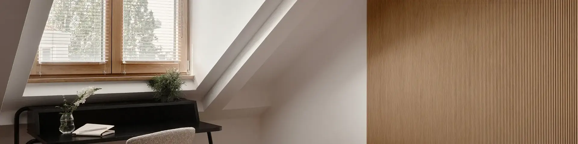 a bed in a room with a desk and a piano