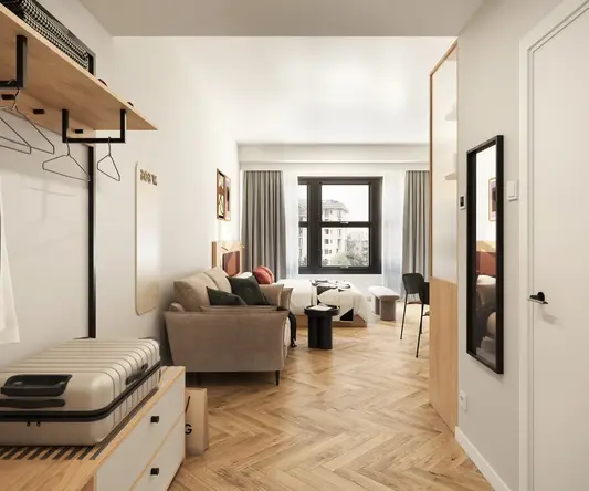 a room with a couch and a suitcase