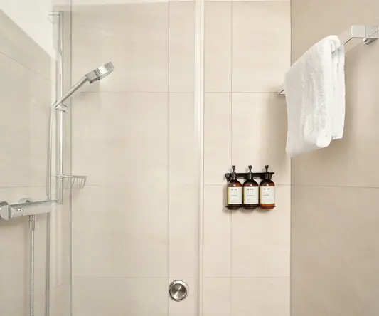 a white towel on a rack in a bathroom