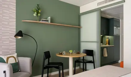 a room with a table and chairs