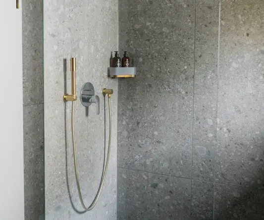 a shower with a hose and a shower head