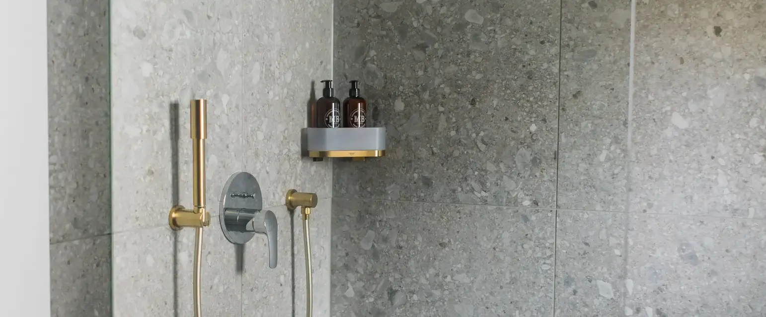 a shower with a hose and a shower head