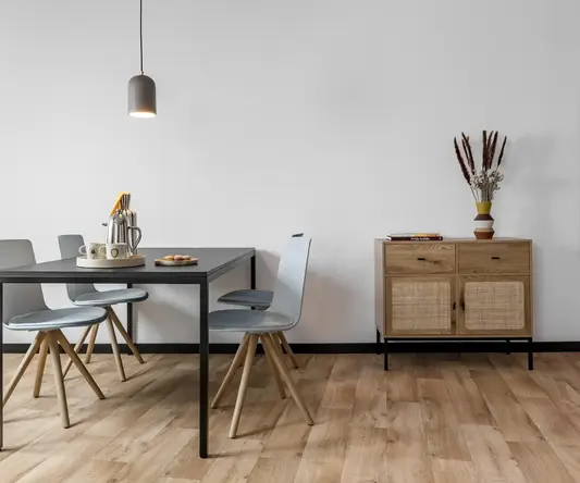 a dining table and chairs in a room