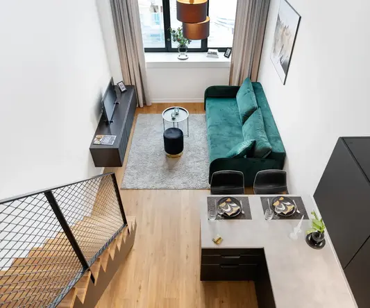 a living room with a couch and a table