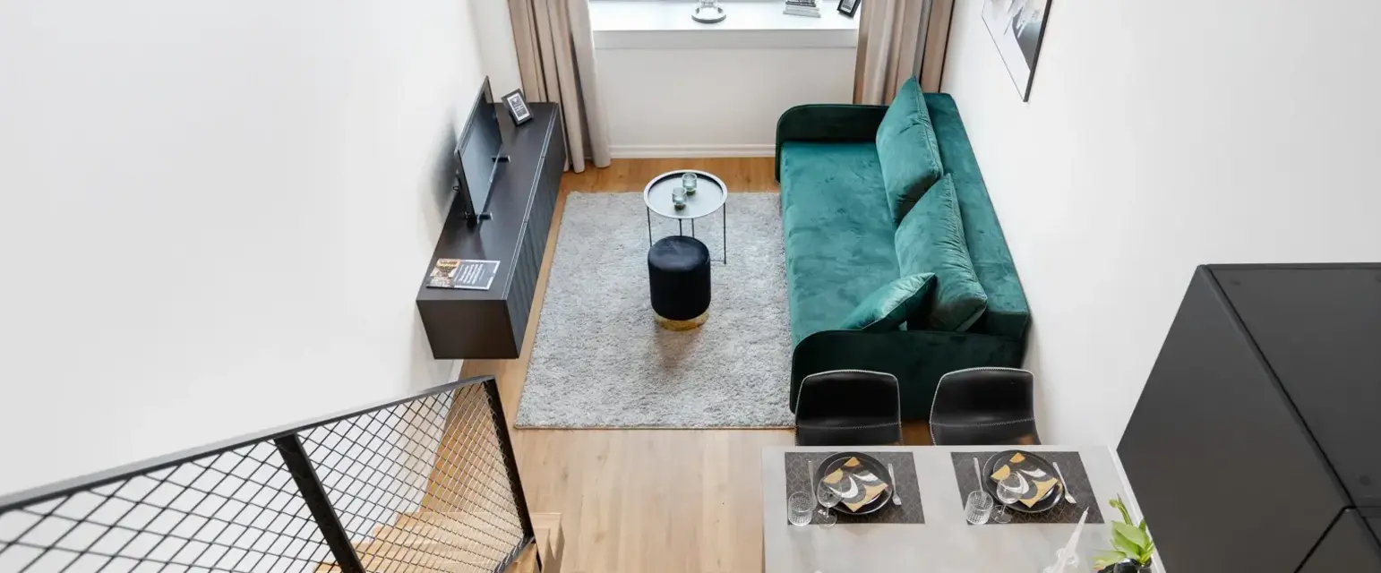 a living room with a couch and a table