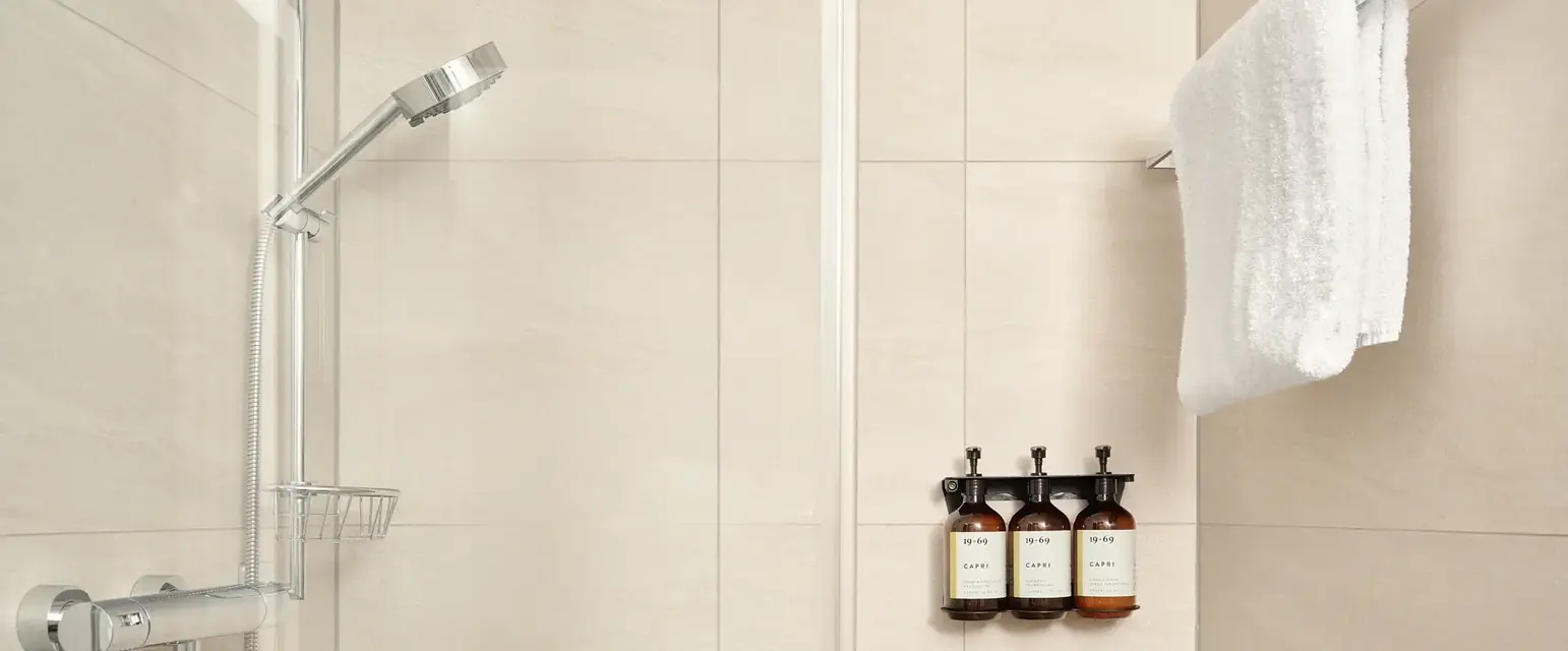 a white towel on a rack in a bathroom